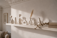 The Sculptural Ceramic Vase collection styled on a wall shelf in a London living room