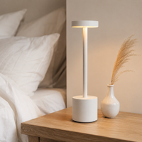 Decorus Designs Ambient Desk Lamp in matte black on a light surface, lifestyle setting
