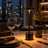 Decorus Designs Ambient Desk Lamp in white on a restaurant table with fine china and crystal glassware