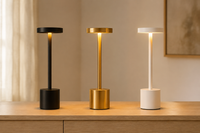 The Ambient Desk Lamp by Decorus Designs in black, gold and white — three slim LED stem table lamps with warm glow