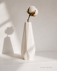Faceted Diamond ceramic vase on white surface