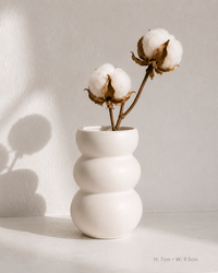 Arch Cutout ceramic vase on white surface