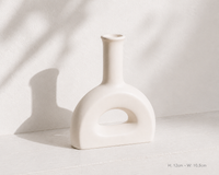 Donut Arch ceramic vase on white surface