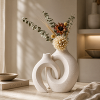 Close up of sculptural white ceramic donut vase frosted matte texture detail