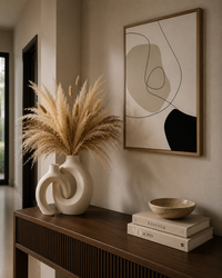 Sculptural ceramic vase set styled on console table luxury minimalist living room
